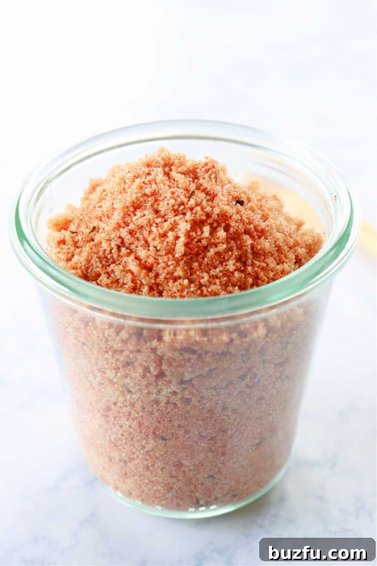 Homemade Dry Rub recipe Dry rub in a clear glass jar, ready for use, symbolizing homemade goodness.