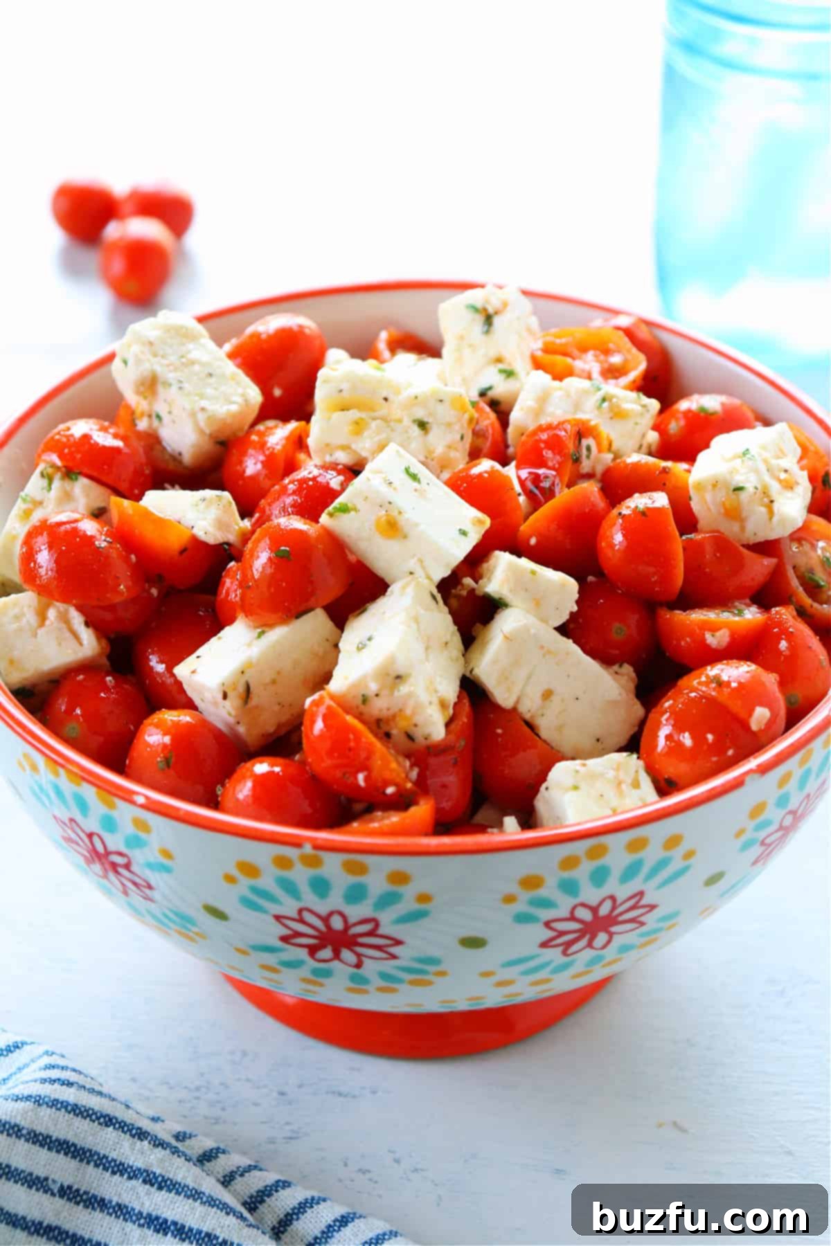 Tomato Feta Salad Recipe for Summer Vibrant tomato and feta salad served in a decorative floral bowl, showcasing fresh ingredients.