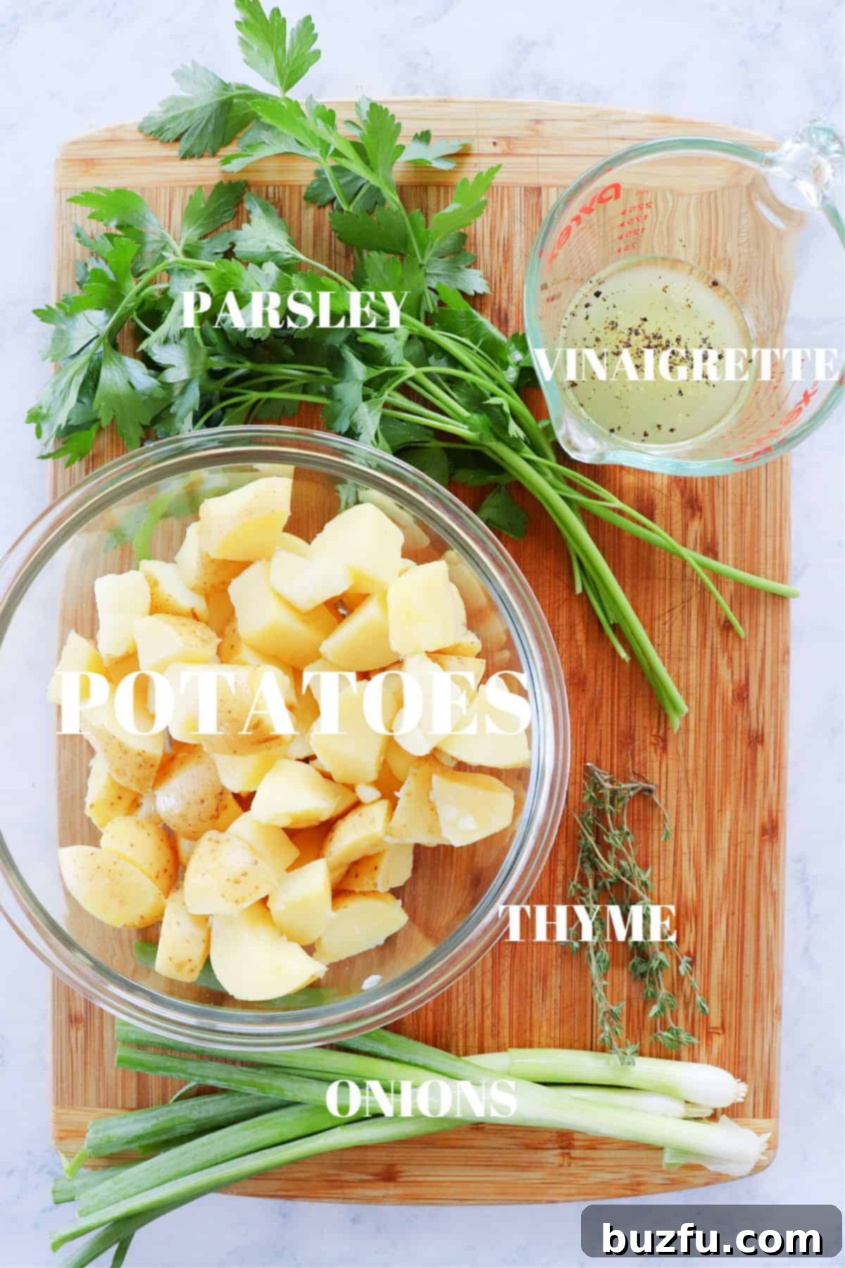 No mayo potato salad ingredients on a cutting board.
