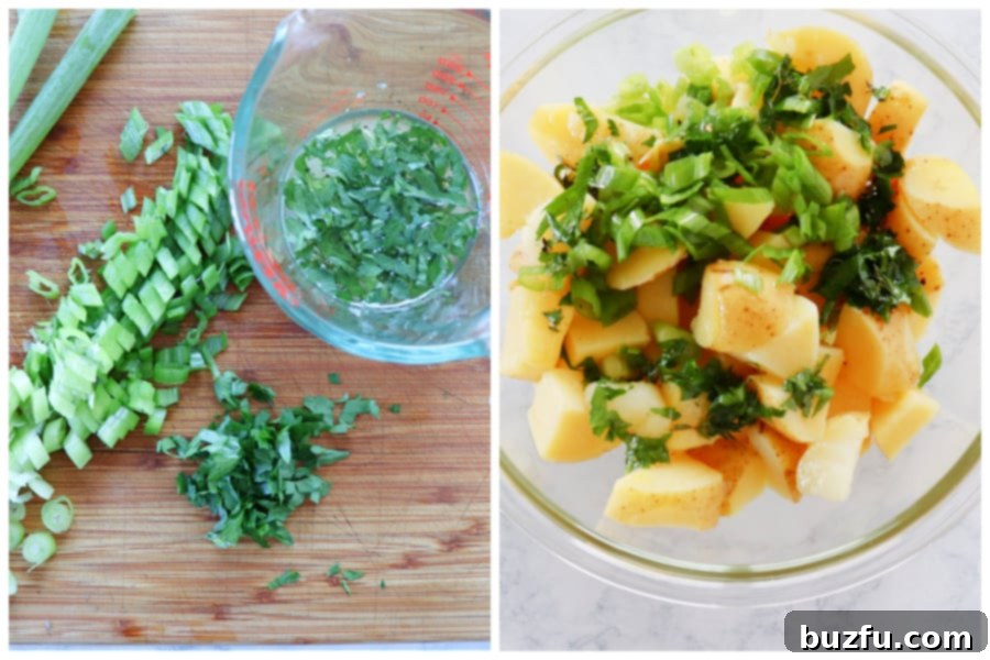 Herbs cut on wooden board and potatoes in a bowl.