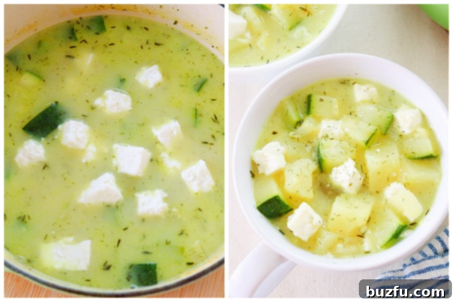 Cream and crumbled feta cheese being stirred into a rich zucchini and potato soup, adding a luxurious finish.