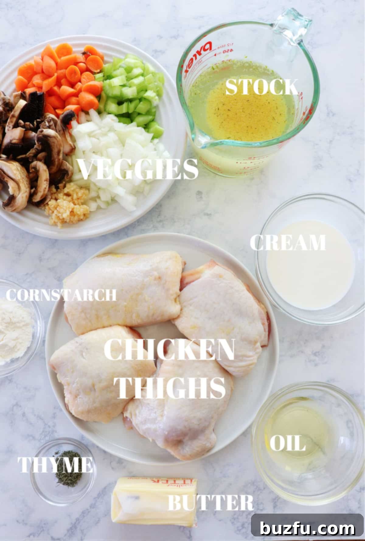 chicken fricassee ingredients Ingredients for chicken fricassee on a marble board.