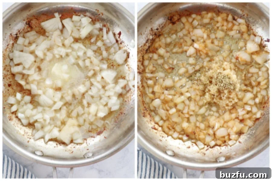 Chopped yellow onion gently cooking in butter and oil in a skillet, turning translucent.