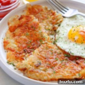 Crispy Golden Hash Browns 3 Hash browns and fried egg on a plate.