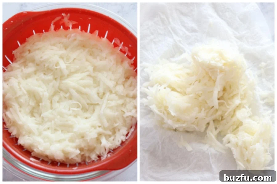 Shred potatoes and squeeze out the moisture Shredded Russet potatoes in a colander after rinsing, ready to be squeezed dry, highlighting the crucial step of moisture removal for crispy hash browns.