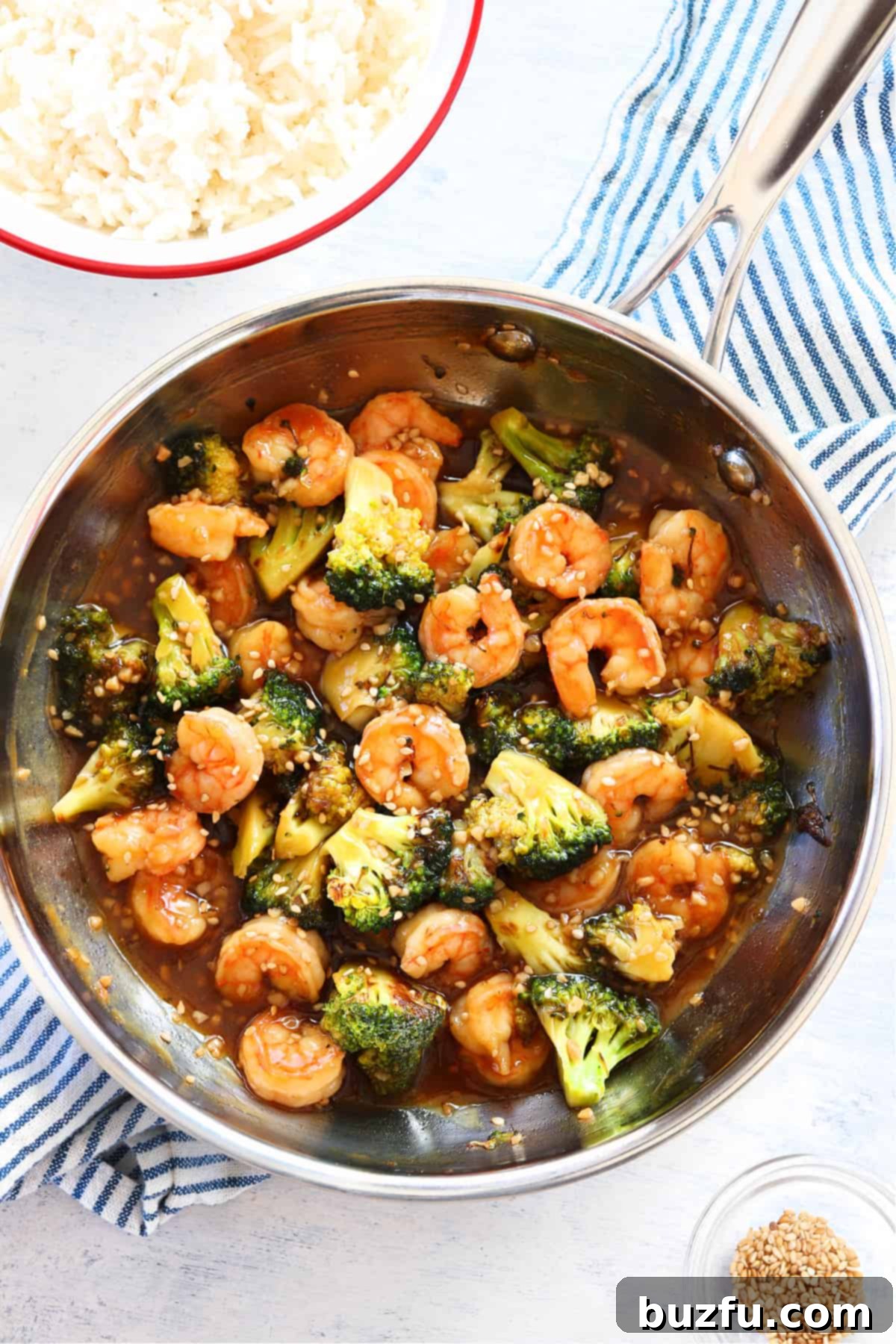 Finished shrimp and broccoli stir fry in a pan, ready to be served.