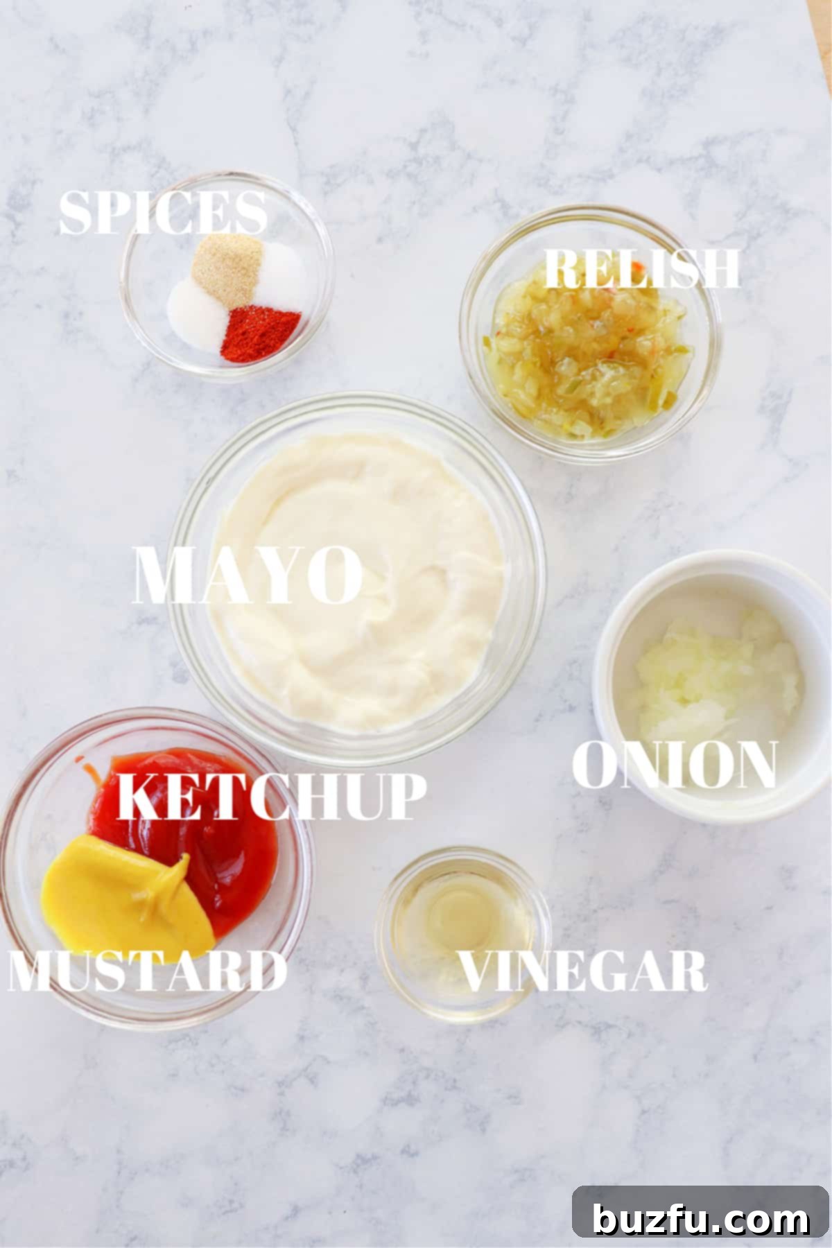 Ingredients for homemade Big Mac sauce All the fresh ingredients for Big Mac sauce laid out on a marble board.