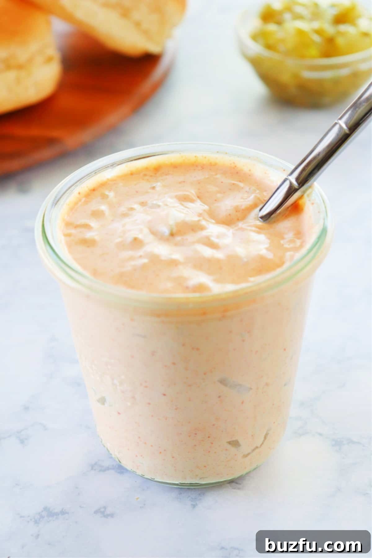 Storing homemade Big Mac Sauce Big Mac sauce stored in a jar with a spoon, ready for use.