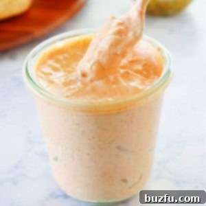 The Ultimate Homemade Big Mac Sauce 3 Homemade Big Mac sauce in a jar with a spoon.