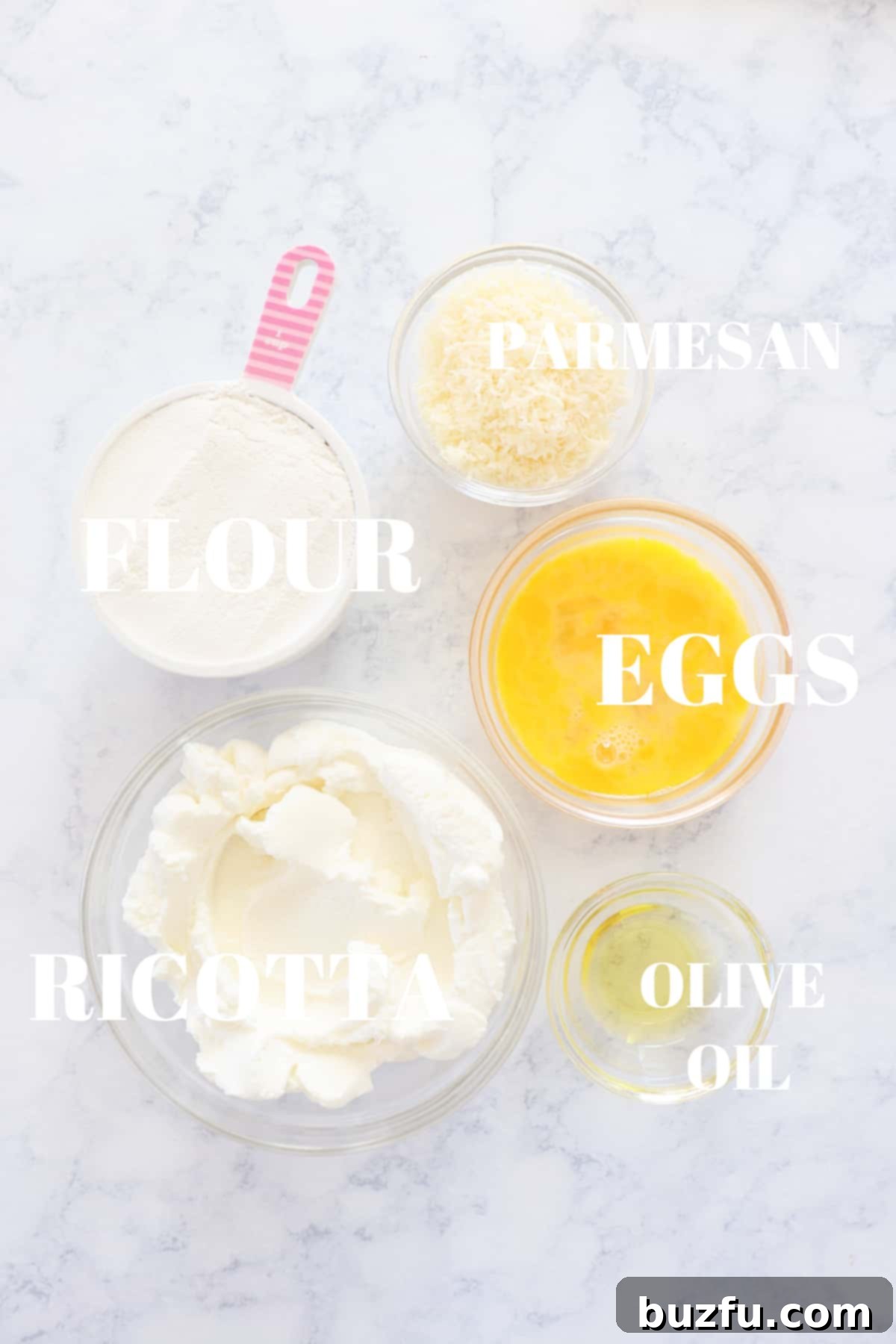 Ricotta Gnocchi Ingredients Ingredients for ricotta gnocchi laid out on a marble board.