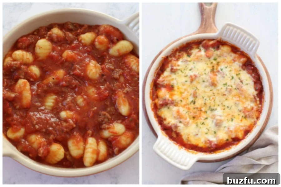 A baking dish filled with gnocchi and sausage in tomato sauce, topped with shredded cheese, ready to be baked in the oven.