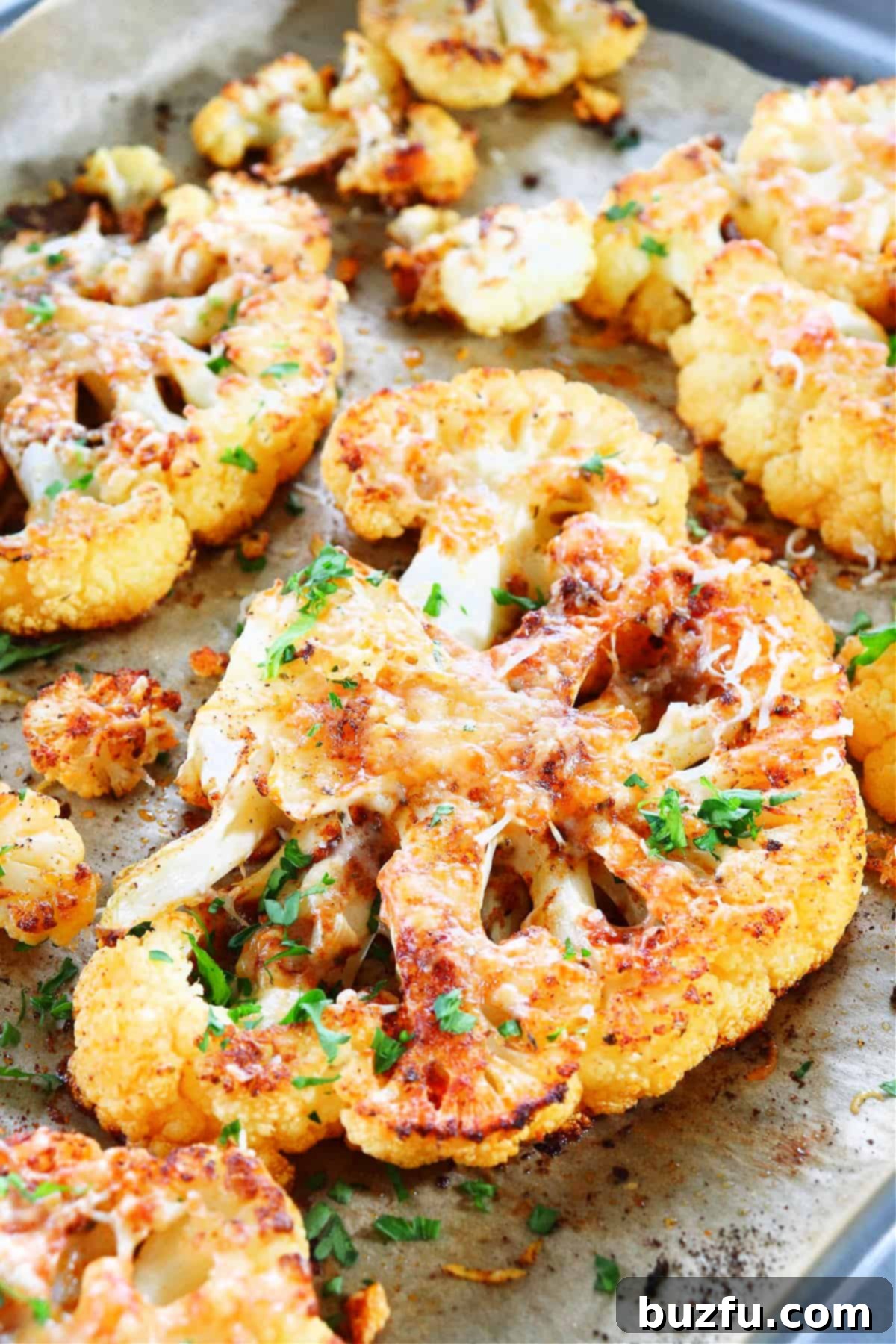 Delicious Roasted Cauliflower Steaks Recipe Perfectly roasted cauliflower steaks on a baking sheet, ready to serve.