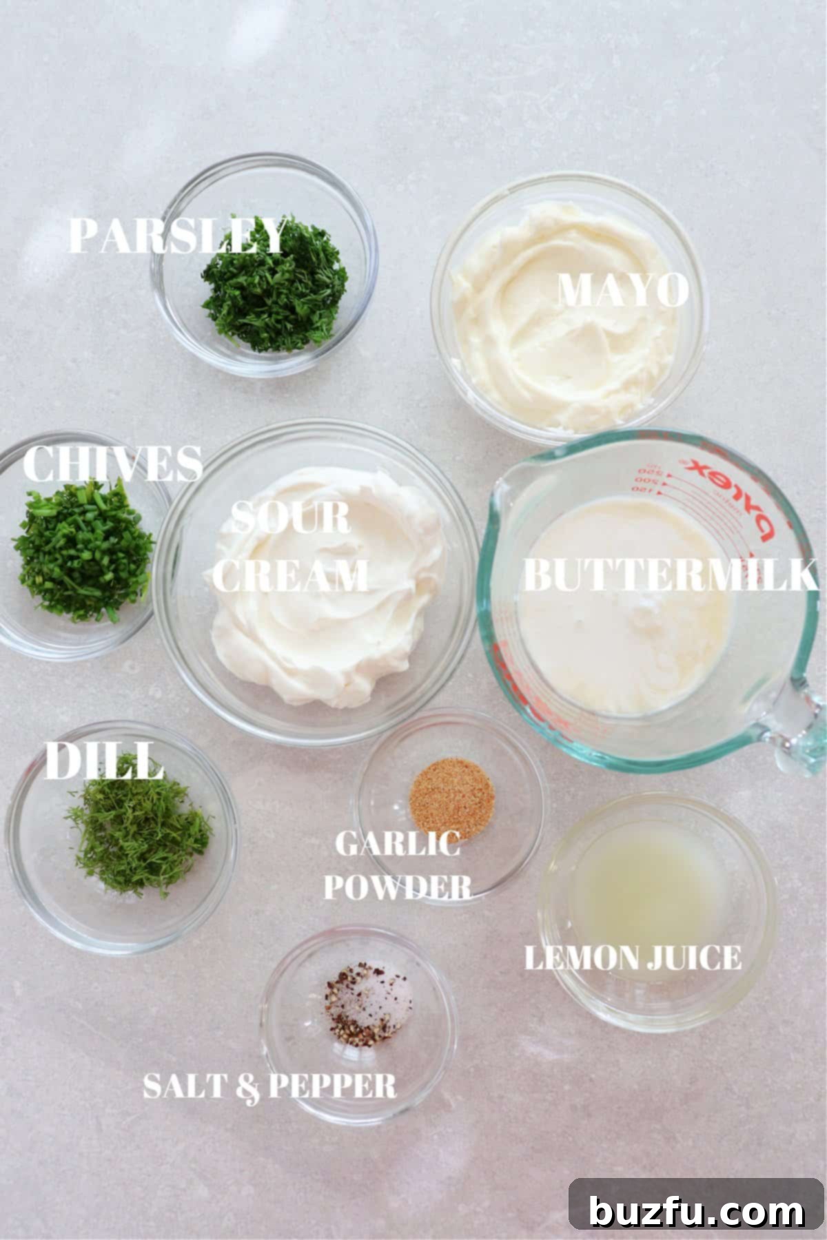 Homemade Ranch Ingredients Ingredients for ranch dressing on a gray board.