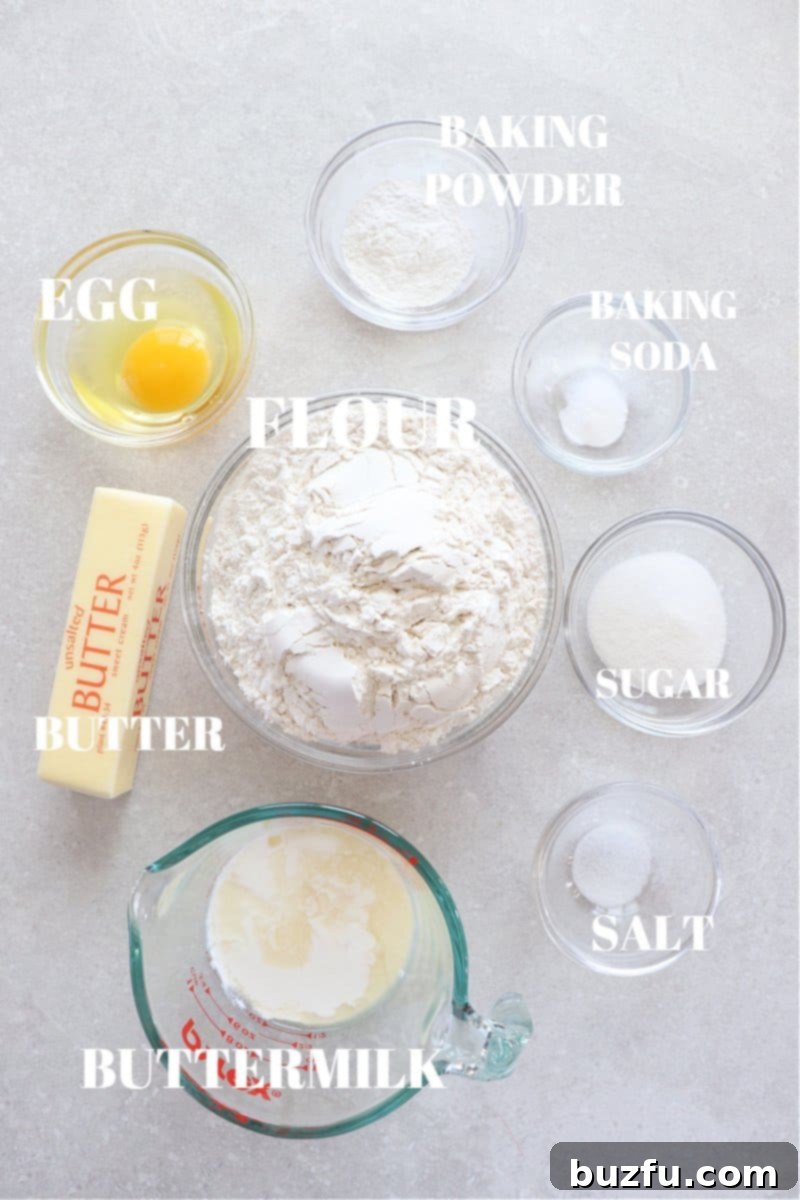 Air Fryer Biscuits Ingredients Ingredients for air fryer biscuits laid out on a wooden board.