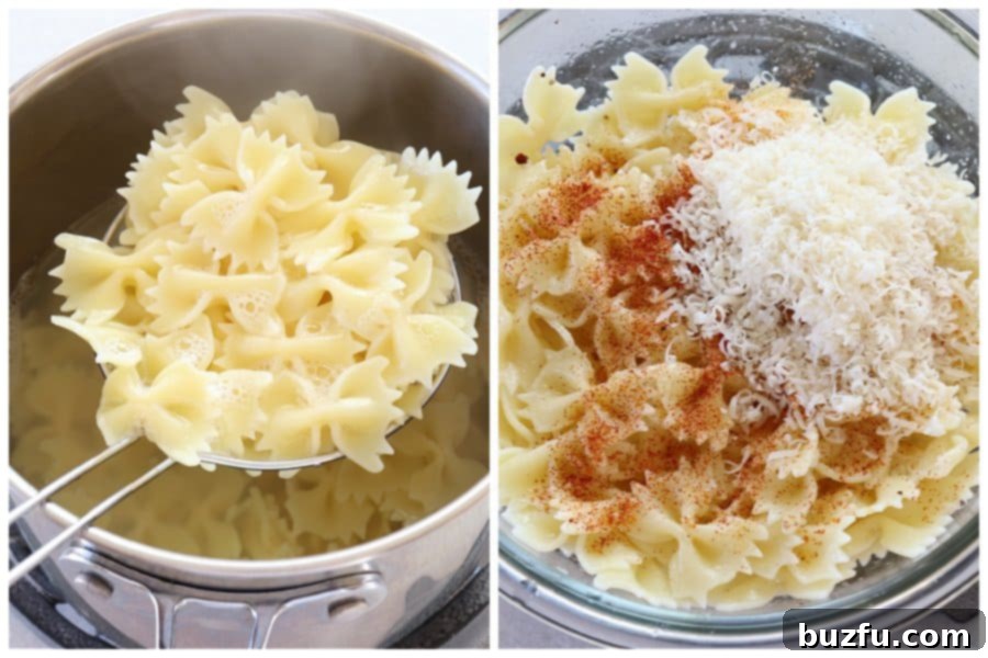 Cook pasta and mix with cheese. Cooked bow-tie pasta mixed with Parmesan cheese and spices in a large bowl, ready for the air fryer.