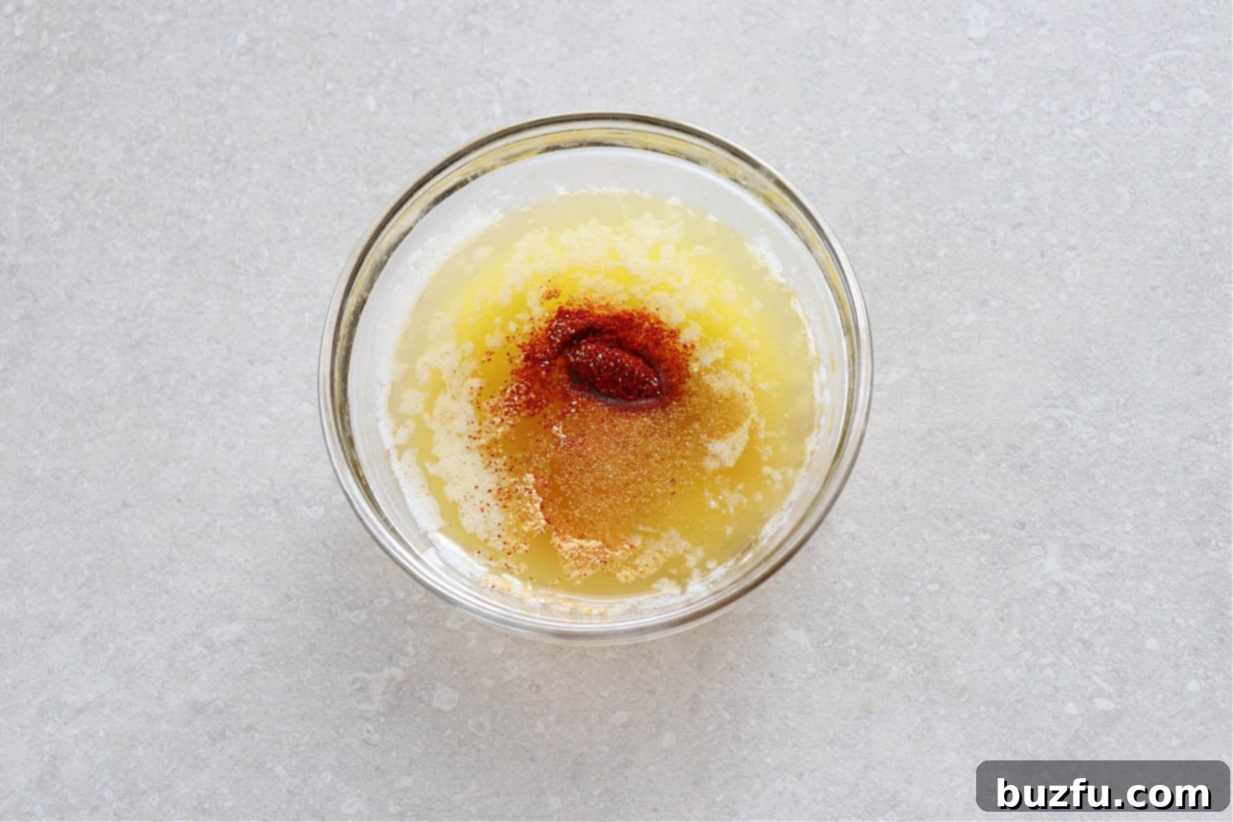 Butter and seasoning in a small bowl.