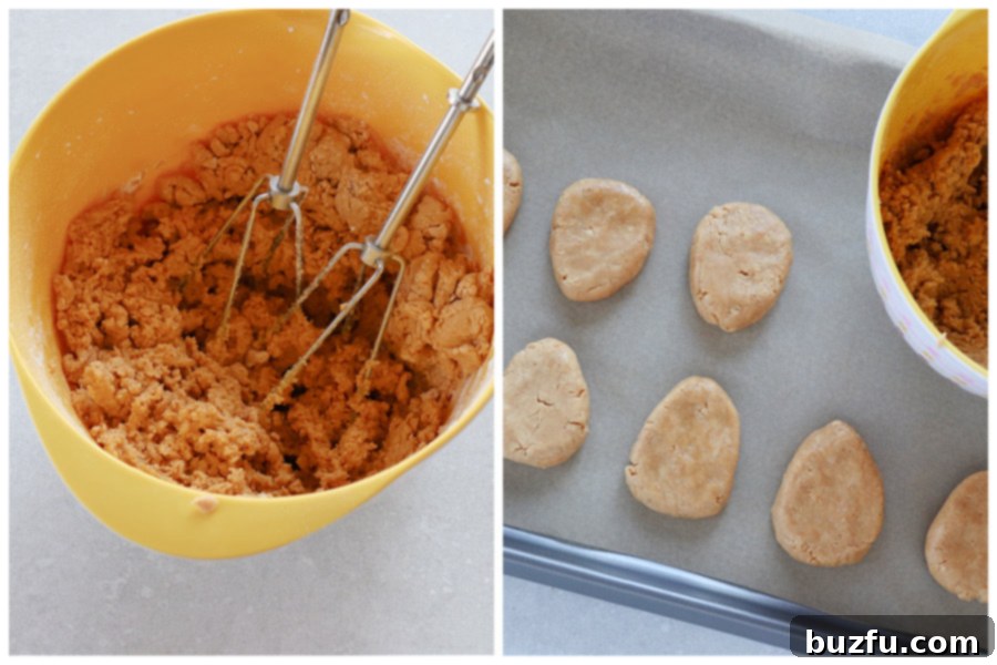 How to form peanut butter eggs from mixture Ingredients mixed in a bowl and formed into eggs on parchment paper.