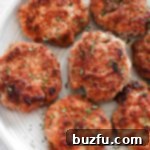 Perfectly browned and seasoned homemade breakfast sausage patties arranged on a rustic plate.