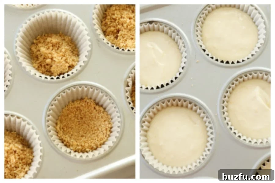 A muffin pan filled with cupcake liners, some containing pre-baked graham cracker crusts, and others already filled with creamy cheesecake batter, illustrating the assembly process.