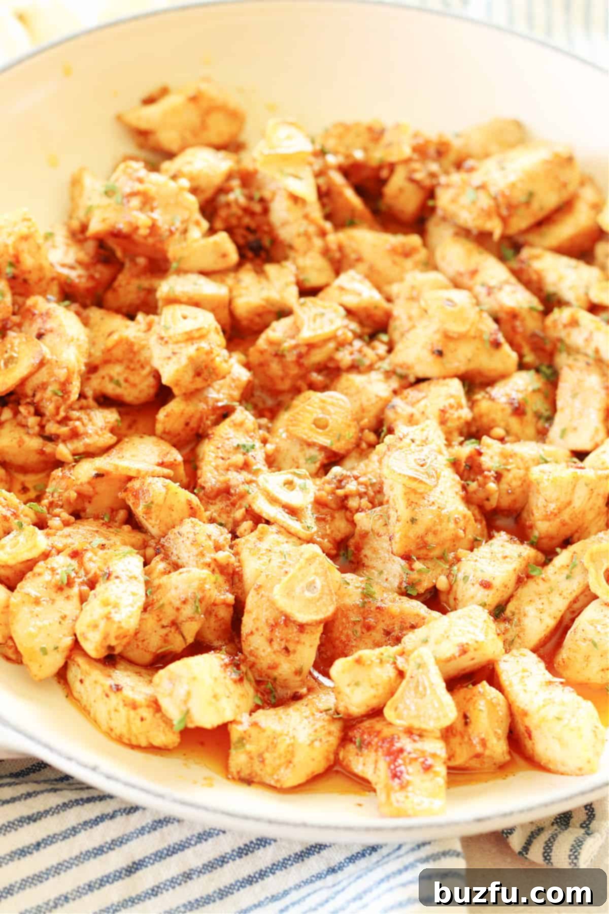 Garlic Butter Chicken - Quick and Delicious Chicken bites in a pan with rich garlic and butter sauce, ready to serve.