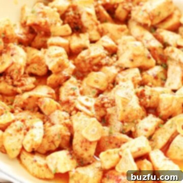 Luscious Garlic Butter Chicken 3 Chicken bites in a pan with garlic and butter sauce.