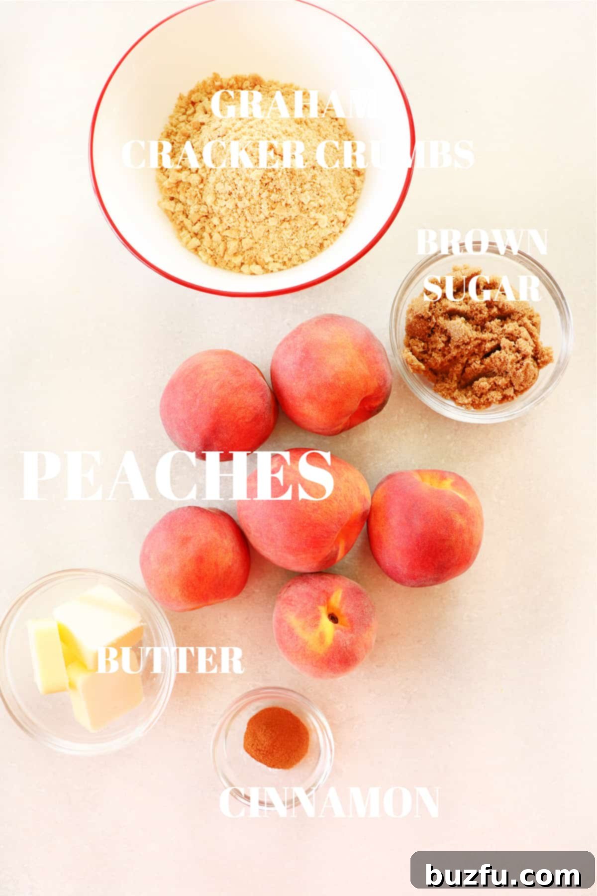 Fresh ingredients come together for a delicious air fryer peach dessert. A beautifully arranged flat lay of fresh, ripe peaches, a bowl of rich brown sugar, sticks of unsalted butter, a pile of graham cracker crumbs, and fragrant cinnamon sticks, showcasing the essential ingredients for creating air fryer peaches.