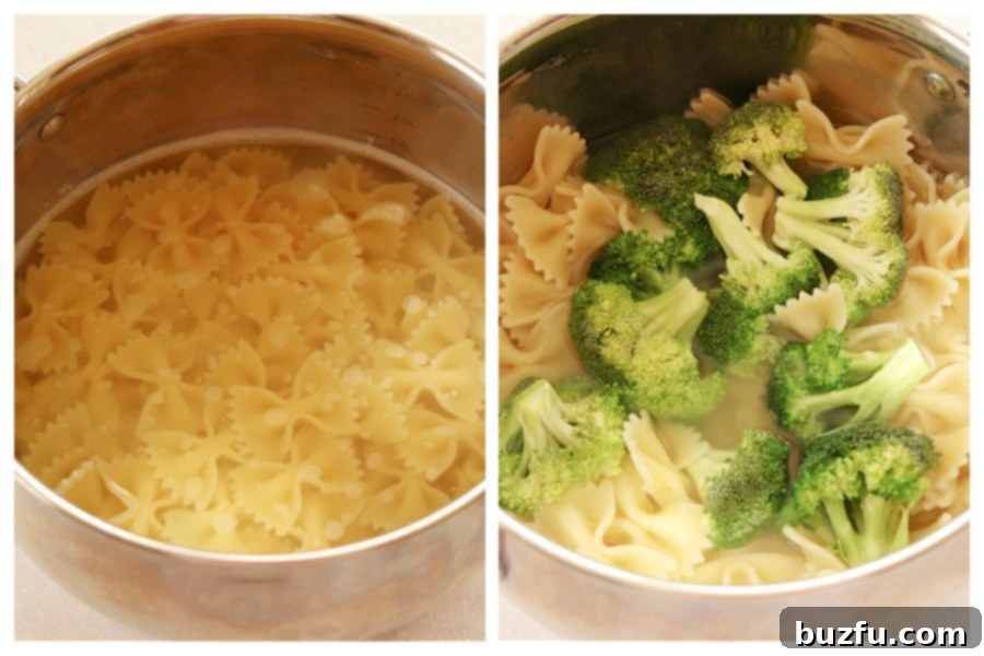 Bow tie pasta cooking in boiling water in a pot, with fresh broccoli florets being added during the last few minutes.