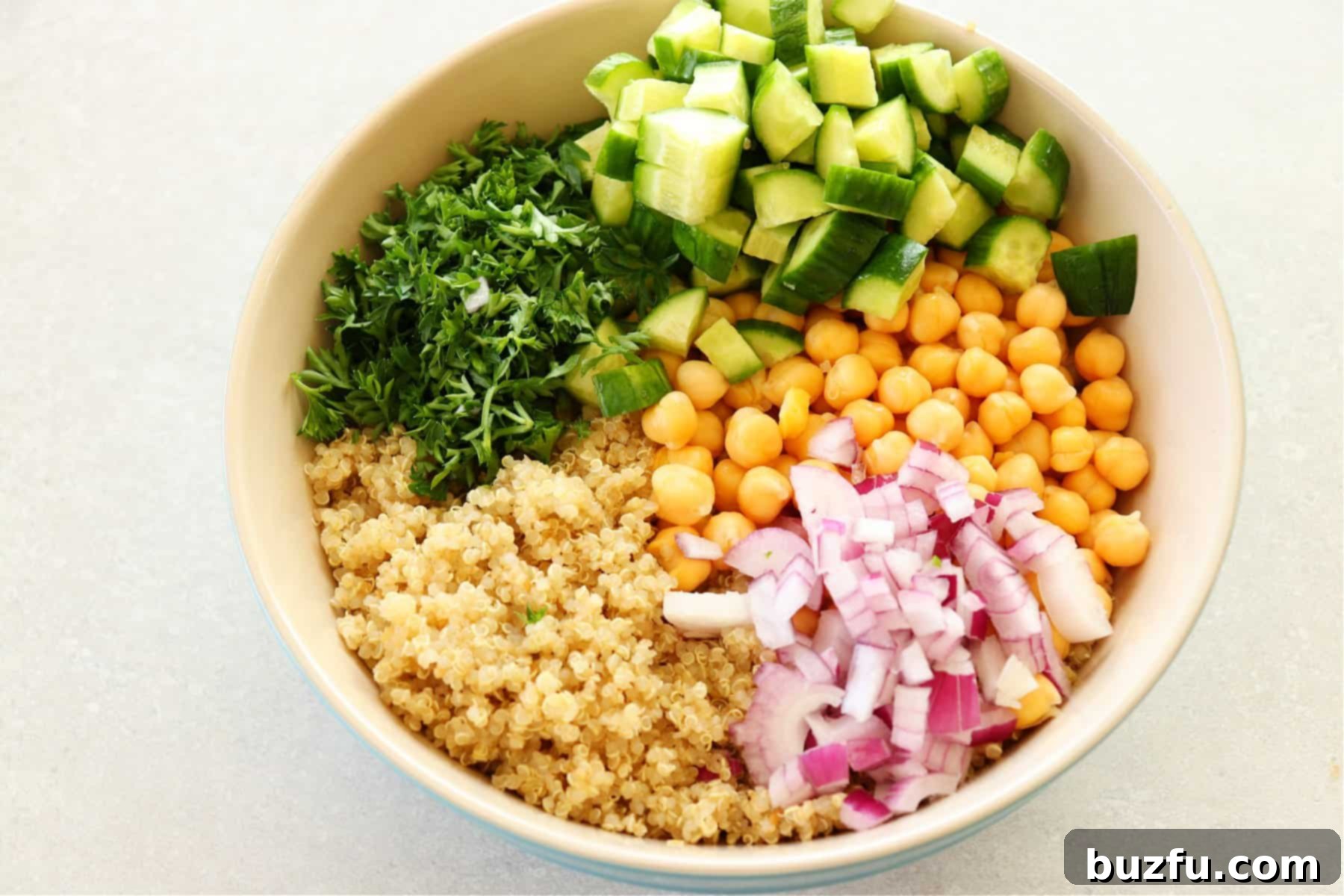 Ingredients for chickpea quinoa salad in a bowl.