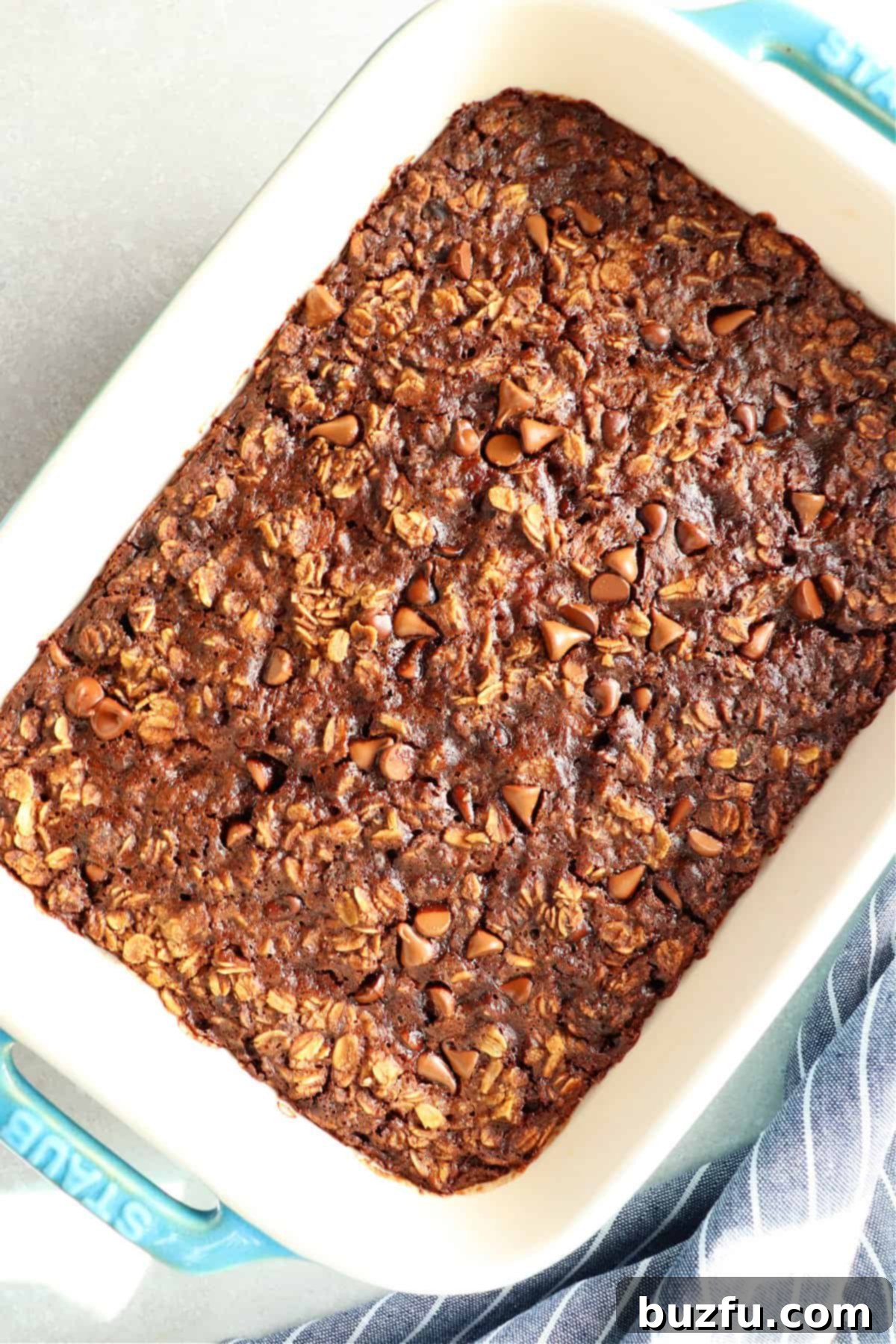 Rich chocolate oatmeal in a Staub rectangular baking dish, warm and comforting.