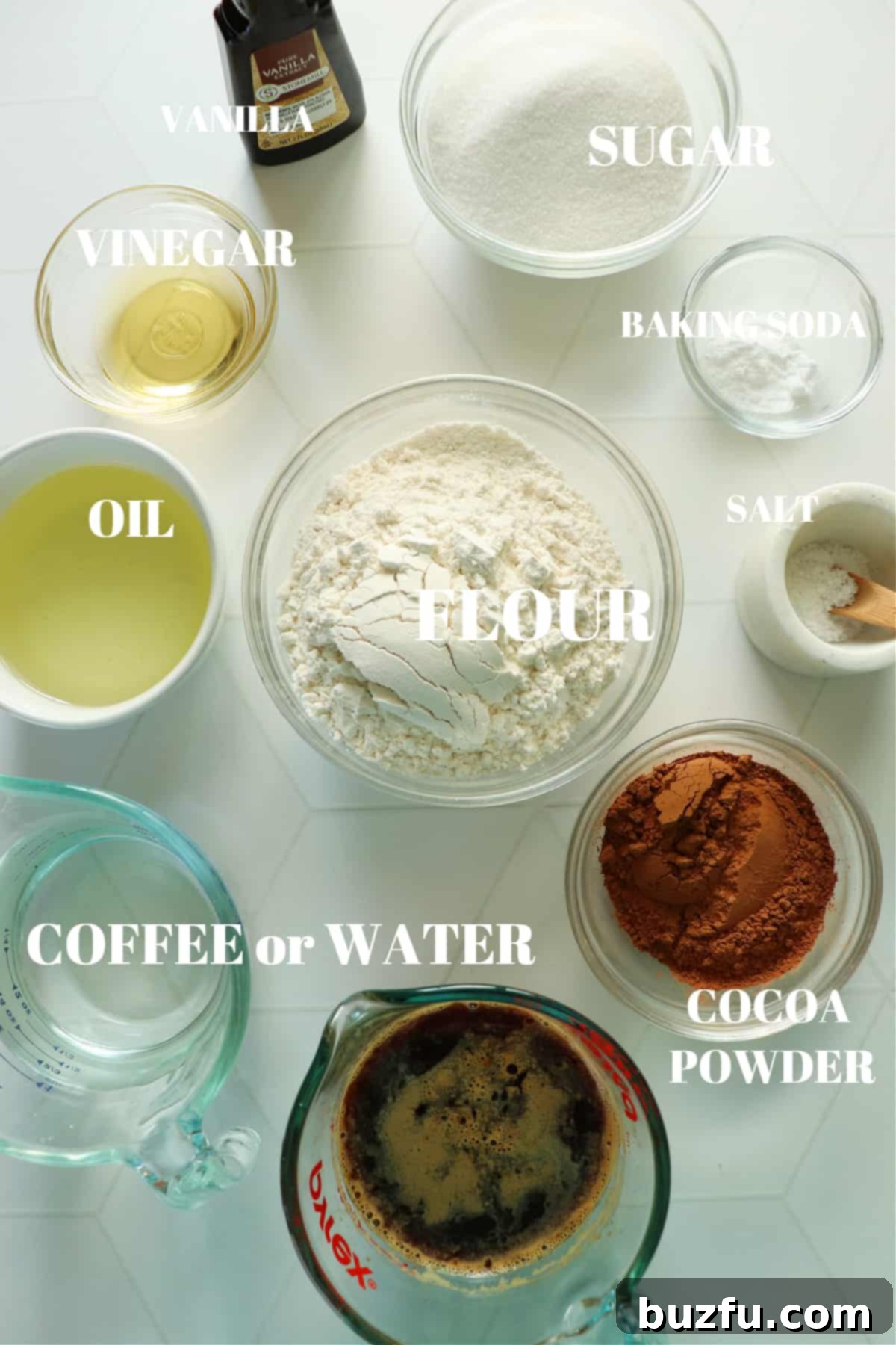 Decadent Eggless Chocolate Delight 3 All ingredients for the eggless chocolate cake on a white tile board.