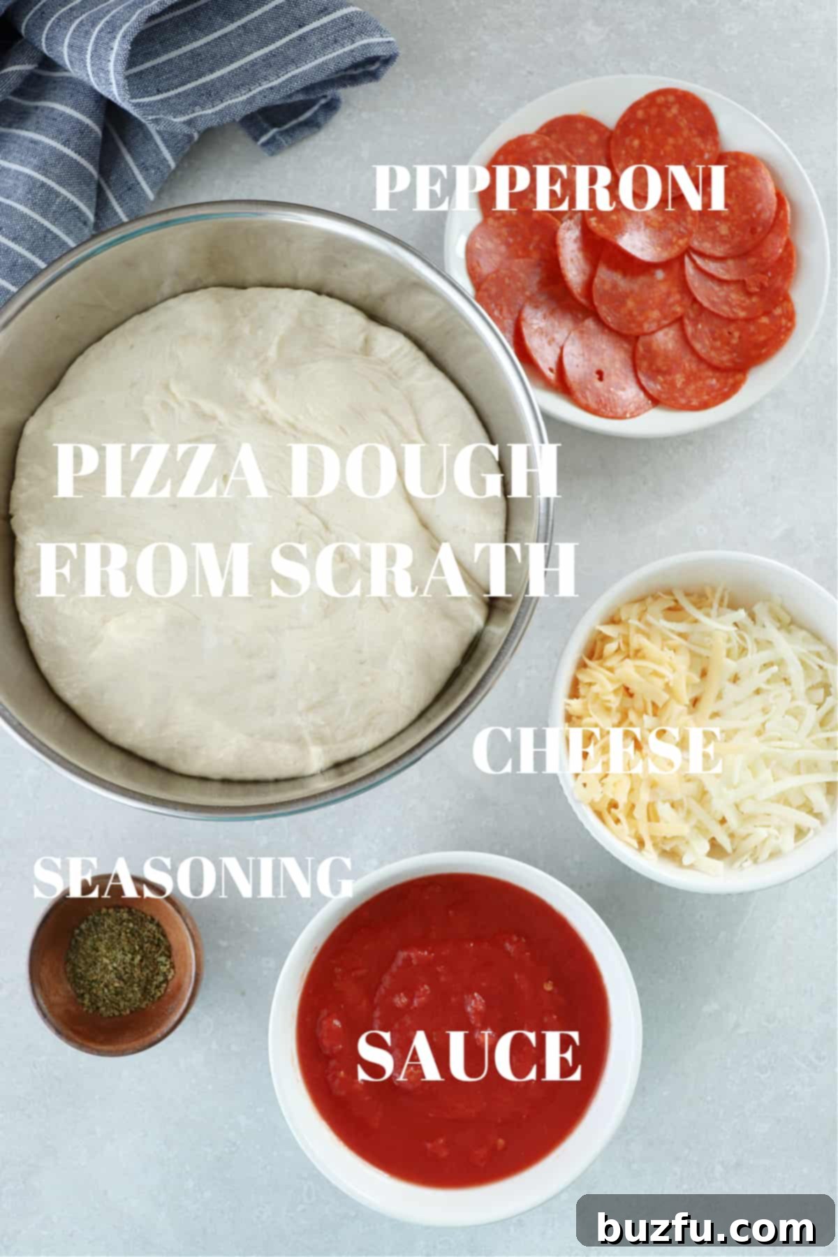 Pizza dough, vibrant tomato sauce, a mix of cheeses, spicy pepperoni, and aromatic seasonings artfully arranged in bowls on a rustic gray board.