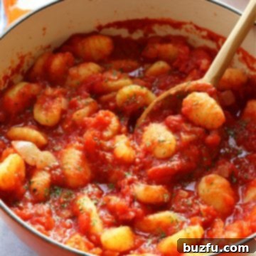Gnocchi in tomato sauce in a Dutch oven.