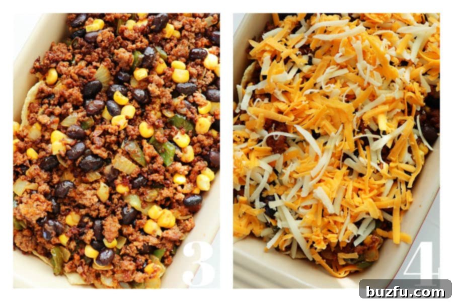 A close-up view of the beef taco filling in a baking dish, generously topped with a layer of melted cheese.