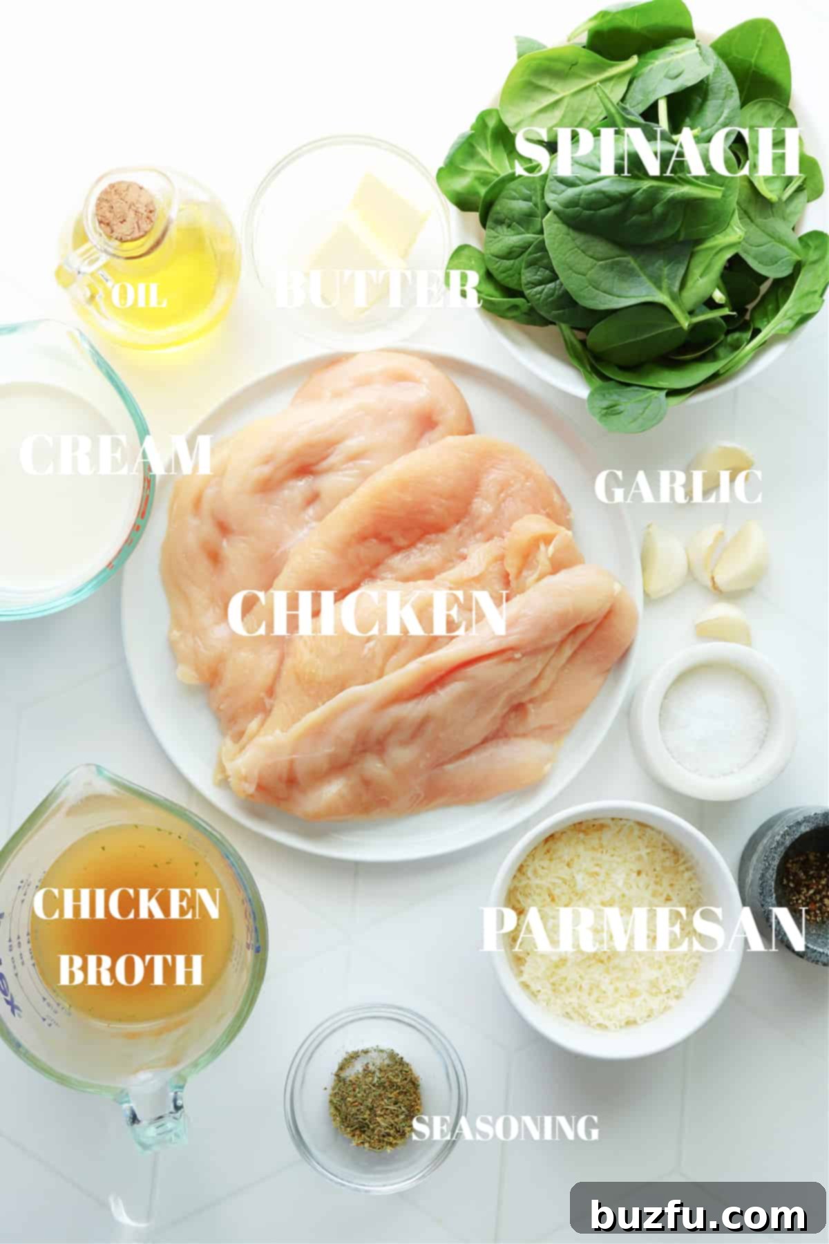All fresh and pantry ingredients meticulously laid out on a clean white tile board, ready for preparing Chicken Florentine.