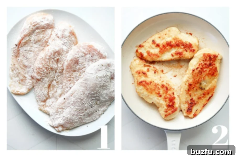 Floured chicken cutlets resting on a white plate, alongside chicken breasts browning in a hot skillet with butter and olive oil.