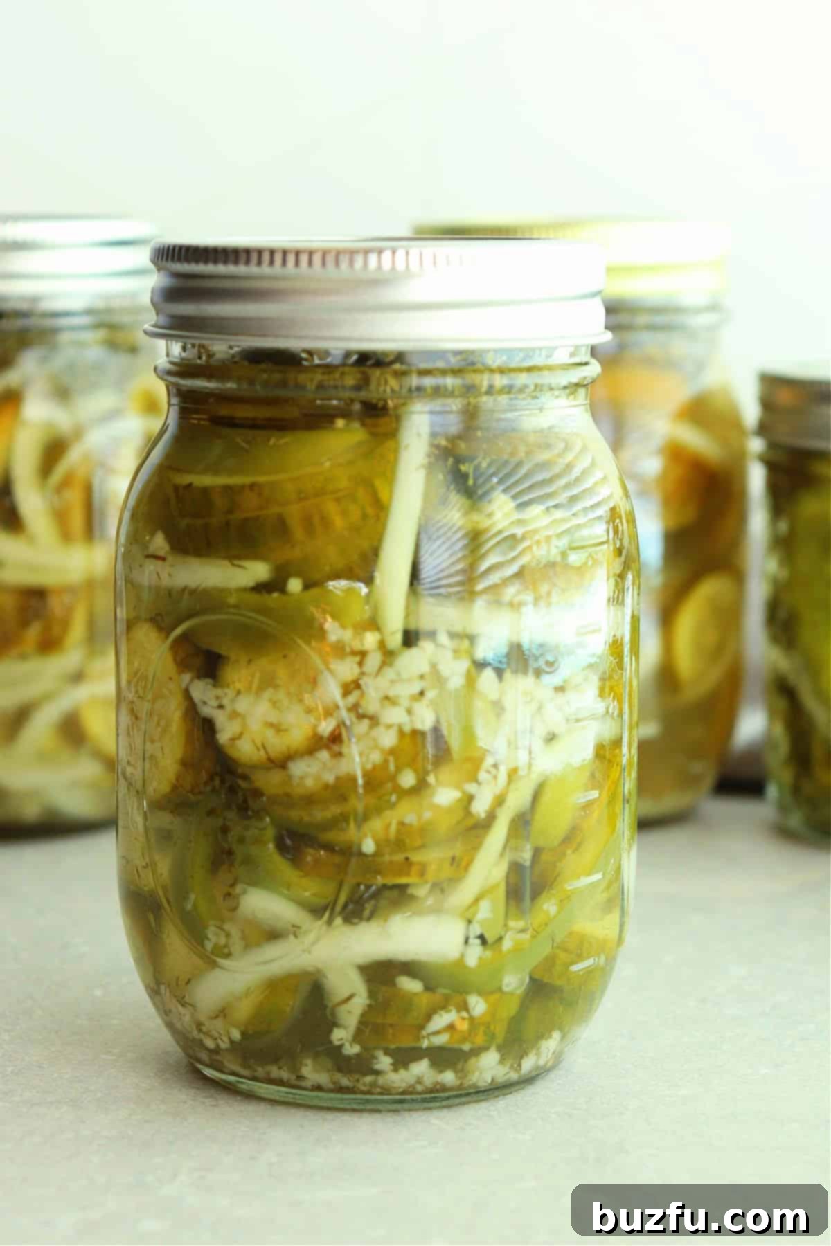 Cucumber, pepper and onion salad, canned in a jar with lid.