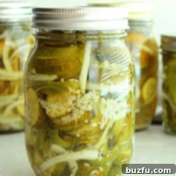 Cucumber, pepper and onion salad, canned in a jar with lid.