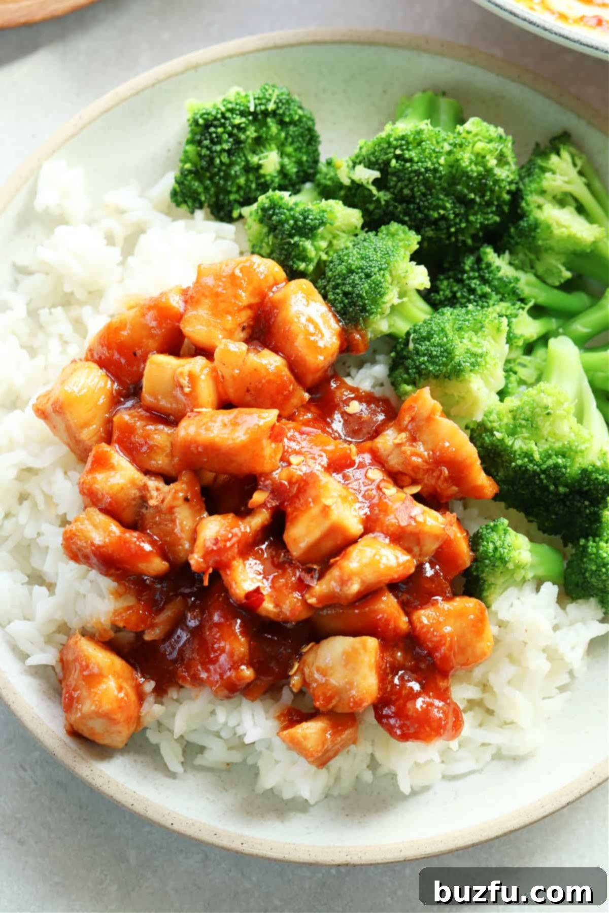 Flavorful Ginger Soy Chicken served over a bed of fluffy rice with steamed broccoli, a healthy and quick Asian-inspired meal.
