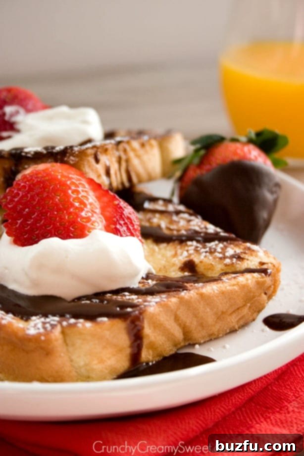 Close-up of French toast with melted chocolate and strawberries
