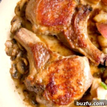 Pork chops in a pan, ready to be served.