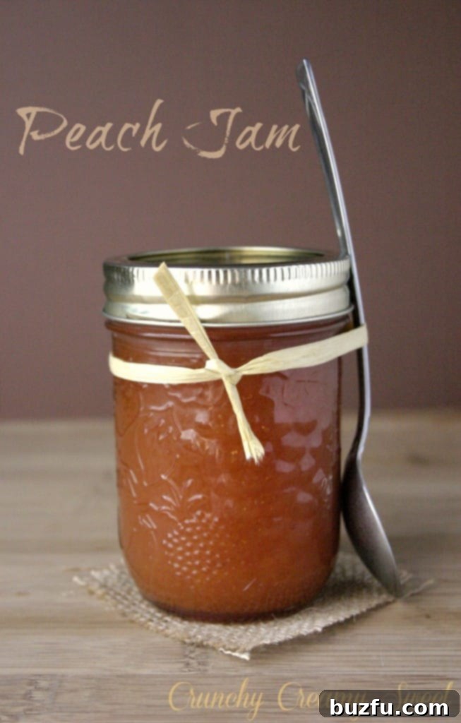peach jam 1 Freshly made peach jam in a jar with sliced peaches in the background.
