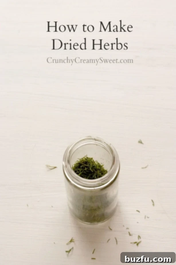 Overhead shot of a slender jar filled with meticulously prepared dried herbs, ready for storage and culinary use.