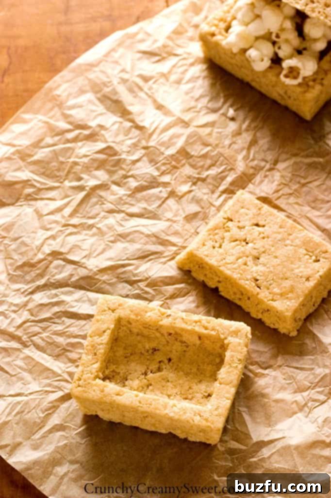 Overhead shot of bottom piece hollowed out, with the top sitting next to it, ready for decorating.
