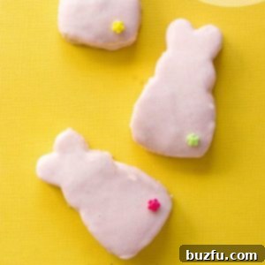 Pink Chocolate Covered Cake Bunnies Three cake bunnies covered with pink chocolate on yellow background, decorated with small flower beads.