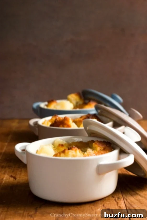 Apricot Pineapple Bread Pudding baking in a beautiful Le Creuset cocotte.