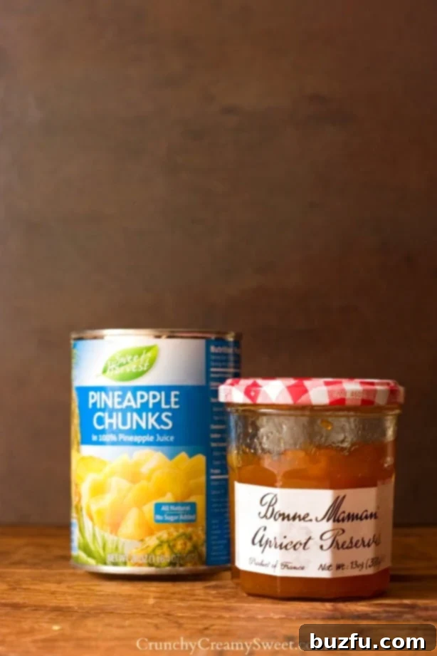Essential ingredients for Pineapple Apricot Bread Pudding: bread cubes, pineapple, and apricot preserves.