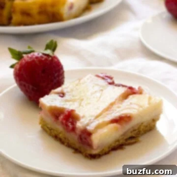 Strawberry Jam Swirl Sour Cream Bars from crunchycreamysweet.com