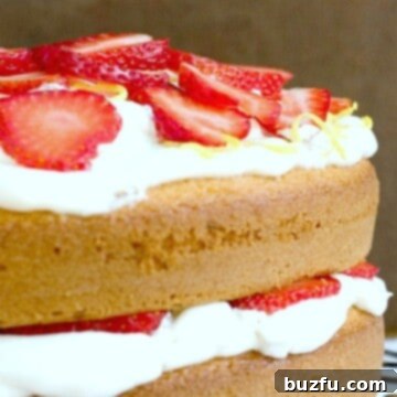 Luscious Lemon Strawberry Layer Cake 2 Lemon and Strawberry Layer Cake on a cooling rack.