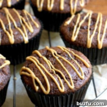 Double Chocolate Muffins with Peanut Butter Glaze on a rack, freshly baked.