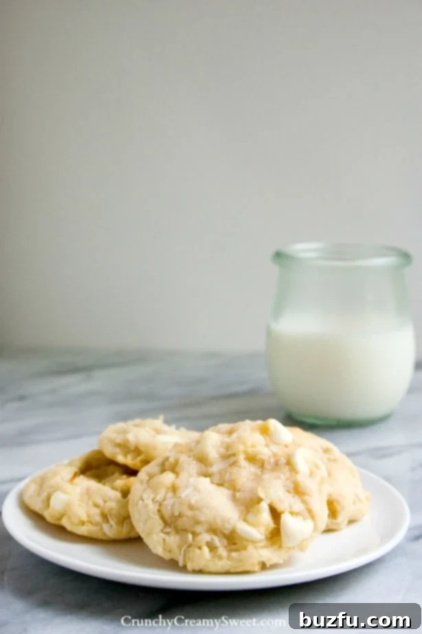 White Chocolate Coconut Cookies - soft sugar cookies packed with white chocolate and coconut. They melt in your mouth!